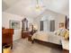 Spacious main bedroom with vaulted ceiling, ample natural light, and classic furniture at 5006 S Nelson St # B, Littleton, CO 80127