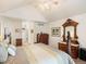 This main bedroom has vaulted ceilings, fan, and a traditional wood vanity at 5006 S Nelson St # B, Littleton, CO 80127