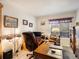 Bright office space with built-in shelving, desk, and natural light from the window at 5006 S Nelson St # B, Littleton, CO 80127