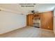 Basement room with fireplace and wood paneling; possible third bedroom at 2692 S Osceola St, Denver, CO 80219