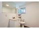 Basement bathroom with a large mirror and vanity at 2692 S Osceola St, Denver, CO 80219