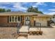Charming brick home featuring a ramp to the front door and an attached garage at 2692 S Osceola St, Denver, CO 80219