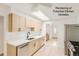 Bright and airy kitchen with stainless steel appliances and sleek cabinets, offering a modern design aesthetic at 2692 S Osceola St, Denver, CO 80219
