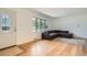 Inviting living room features hardwood floors and a large bay window offering abundant natural light at 2692 S Osceola St, Denver, CO 80219