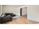 Spacious living room with hardwood floors and a comfortable sofa, perfect for relaxing and entertaining at 2692 S Osceola St, Denver, CO 80219