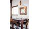 Cozy dining area with stylish seating and a modern light fixture above a rustic, dark wood table at 3733 N Franklin St, Denver, CO 80205