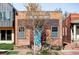 Front exterior view of a brick building, showing the building's unique architecture and landscaping at 3733 N Franklin St, Denver, CO 80205