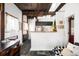Cozy kitchen area featuring wooden beams, a breakfast bar, and stylish decor throughout at 3733 N Franklin St, Denver, CO 80205
