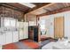 Bright kitchen area featuring white cabinets and exposed brick, with views through an adjacent dining area at 3733 N Franklin St, Denver, CO 80205