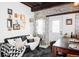 Inviting living room with a comfortable couch, exposed brick, and eclectic decor at 3733 N Franklin St, Denver, CO 80205