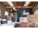 Open concept living space with exposed beams, brick walls, and modern decor, offering a unique and stylish design at 3733 N Franklin St, Denver, CO 80205