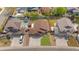 Aerial view of property showcasing backyard, driveway, and nearby houses at 1694 Jennifer St, Brighton, CO 80601