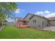 A well maintained backyard with a cozy deck and pergola for outdoor enjoyment at 1694 Jennifer St, Brighton, CO 80601