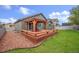 Large backyard featuring a spacious deck with a pergola perfect for outdoor entertaining at 1694 Jennifer St, Brighton, CO 80601