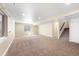 Spacious basement featuring neutral paint, plush carpeting, and a large window for natural lighting at 1694 Jennifer St, Brighton, CO 80601