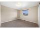 Bedroom featuring neutral walls and carpet, and a window for natural light at 1694 Jennifer St, Brighton, CO 80601
