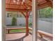 Wooden backyard deck featuring a pergola with seating, ideal for outdoor relaxation at 1694 Jennifer St, Brighton, CO 80601