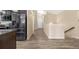 Entryway with hardwood flooring and views of the kitchen at 1694 Jennifer St, Brighton, CO 80601