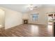 Inviting living room with fireplace, ceiling fan and natural light at 1694 Jennifer St, Brighton, CO 80601
