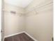 Functional walk-in closet with ample shelving and storage, providing organization for clothing and accessories at 1694 Jennifer St, Brighton, CO 80601