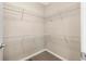 Walk-in closet features wall-mounted wire shelving units at 1694 Jennifer St, Brighton, CO 80601