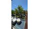 Cozy balcony featuring outdoor seating with a view of green trees, cars, and a blue sky at 4181 W 118Th Pl, Westminster, CO 80031