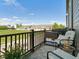 Relaxing balcony with comfortable seating, a small grill, and a pleasant neighborhood view at 4181 W 118Th Pl, Westminster, CO 80031