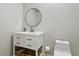 Well decorated bathroom with a round mirror above the vanity and a toilet with a modern design at 4181 W 118Th Pl, Westminster, CO 80031