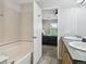 Bright bathroom with double sinks and tiled floor opens into the bedroom at 4181 W 118Th Pl, Westminster, CO 80031