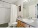 Bright bathroom featuring a shower over tub, modern vanity and decorative accents at 4181 W 118Th Pl, Westminster, CO 80031