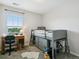 Bedroom featuring a lofted bed with built-in storage, a desk, and a window at 4181 W 118Th Pl, Westminster, CO 80031