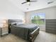 Bedroom featuring a large bed with stylish headboard, ceiling fan, and a window at 4181 W 118Th Pl, Westminster, CO 80031