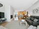Spacious living area with an open floor plan, hardwood floors, and modern fireplace at 4181 W 118Th Pl, Westminster, CO 80031
