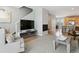 Cozy living area with fireplace, TV, and open layout to the adjacent dining and kitchen at 4181 W 118Th Pl, Westminster, CO 80031