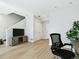 Living room featuring a TV, built-in fireplace, and natural light at 4181 W 118Th Pl, Westminster, CO 80031