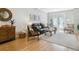 Bright living room with wood floors, stylish furniture, and double doors to balcony at 4181 W 118Th Pl, Westminster, CO 80031
