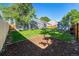 Spacious backyard offering a shed, established trees, and a manicured lawn at 19523 E Buchanan Pl, Aurora, CO 80011