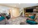 Spacious basement living area featuring comfortable seating and a unique accent wall at 19523 E Buchanan Pl, Aurora, CO 80011