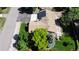 Aerial view of the house shows lush lawns, mature trees, solar panels, a large patio and a spacious driveway at 8644 S Brentwood St, Littleton, CO 80128