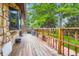 Spacious wood deck overlooking the backyard with lush landscaping at 8644 S Brentwood St, Littleton, CO 80128