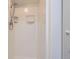 Bathroom stall featuring tiled walls and a shower head at 8644 S Brentwood St, Littleton, CO 80128