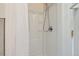 Shower stall with white fixtures, and metal shower head at 8644 S Brentwood St, Littleton, CO 80128