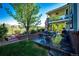 Landscaped backyard with stone patio, perfect for outdoor dining and relaxation at 22685 E Calhoun Pl, Aurora, CO 80016