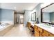 Spacious bathroom featuring double vanities, soaking tub, and tile flooring at 22685 E Calhoun Pl, Aurora, CO 80016