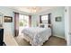 This cozy bedroom has a ceiling fan and plenty of natural light at 22685 E Calhoun Pl, Aurora, CO 80016