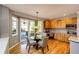 Cozy breakfast nook with backyard access and wood floors next to the kitchen at 22685 E Calhoun Pl, Aurora, CO 80016