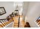 Stunning foyer showcasing hardwood floors, a grand staircase, and abundant natural light at 22685 E Calhoun Pl, Aurora, CO 80016