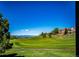 Scenic golf course view with a house on a hill at 22685 E Calhoun Pl, Aurora, CO 80016