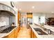 Well-equipped kitchen features wood floors, granite counters, stainless steel appliances, and gas range at 22685 E Calhoun Pl, Aurora, CO 80016