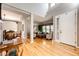 Bright living room with hardwood floors, large windows, and stylish decor creating a welcoming atmosphere at 22685 E Calhoun Pl, Aurora, CO 80016